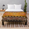 Aztec pattern Navajo plush blanket in warm, earthy tones