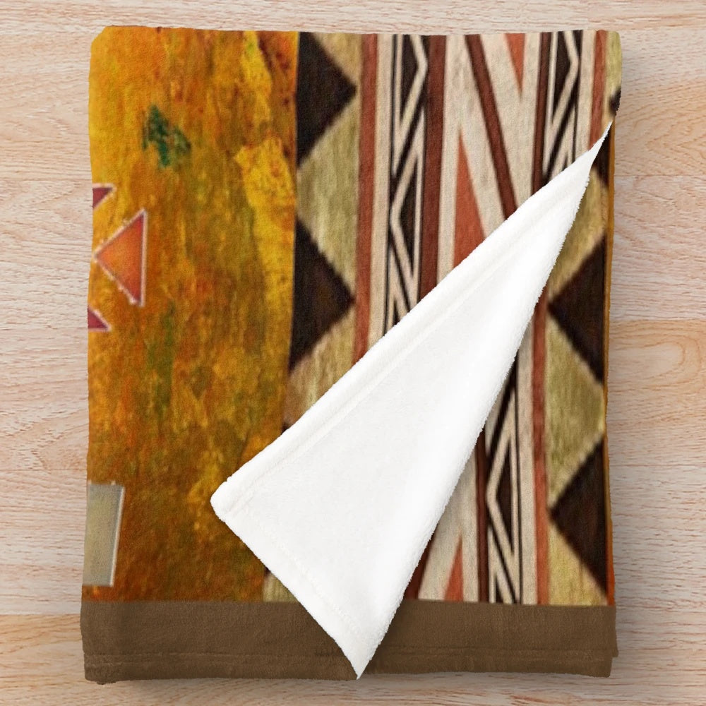 Aztec pattern Navajo plush blanket in warm, earthy tones