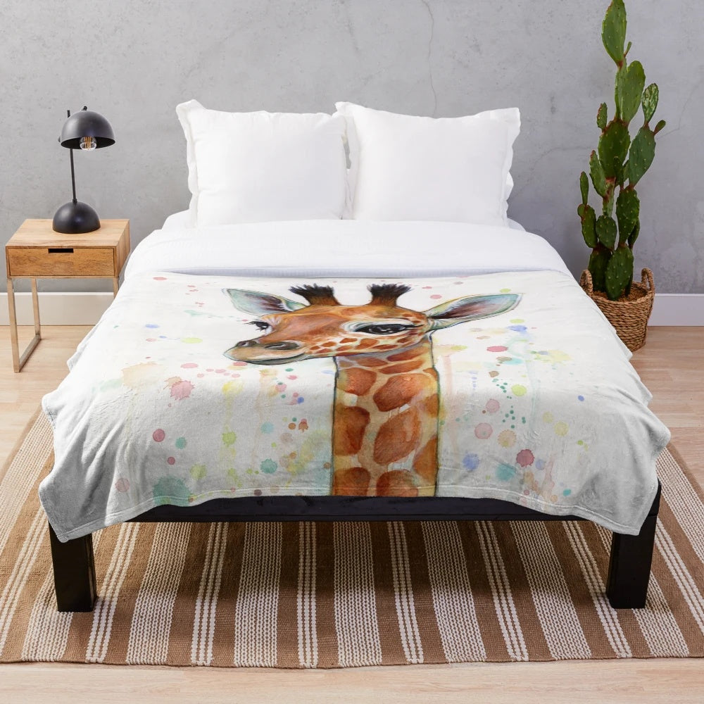 A soft and plush baby giraffe blanket featuring a watercolor painting
