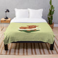 Soft and cuddly baby plush blanket featuring a cute highland cow design