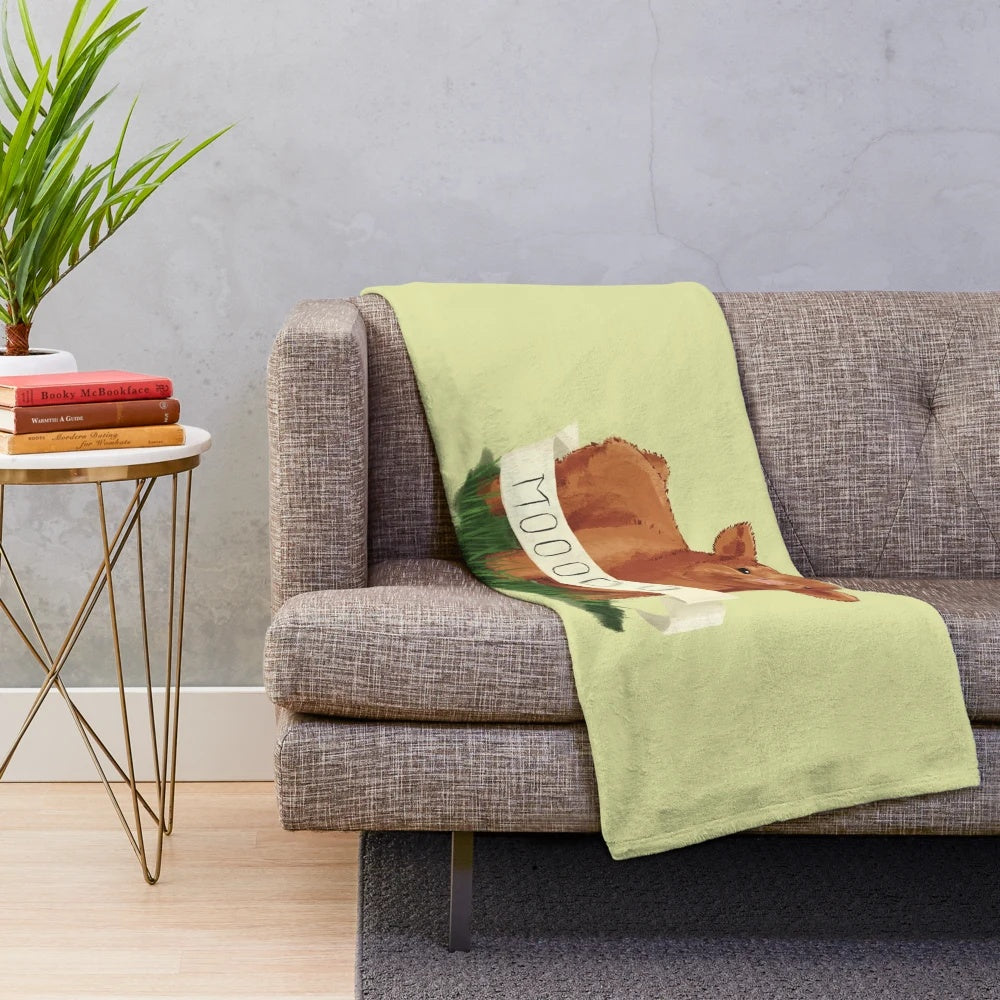 Soft and cuddly baby plush blanket featuring a cute highland cow design