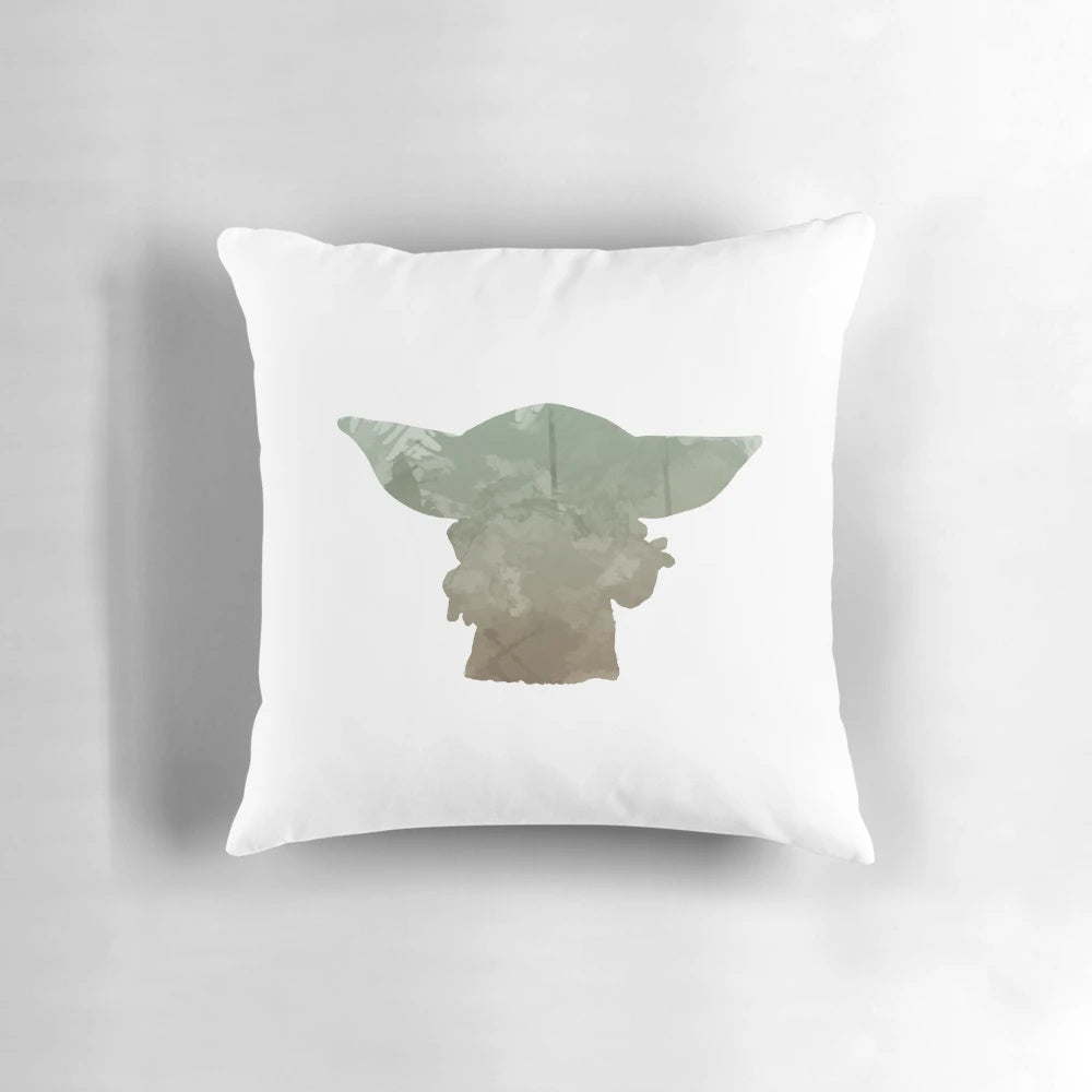 A soft, plush pillow featuring a watercolor-inspired silhouette design of Baby Yoda from the popular TV series The Mandalorian.