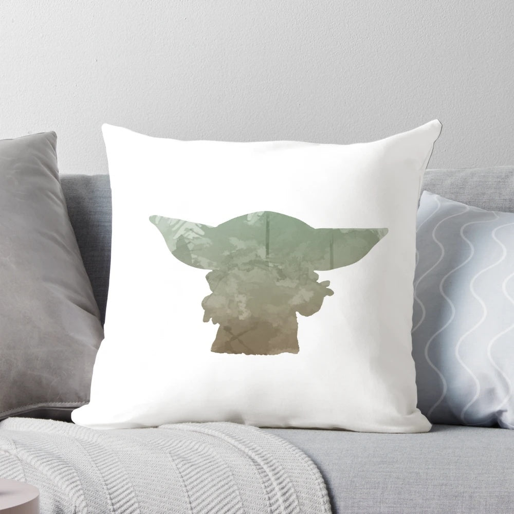 A soft, plush pillow featuring a watercolor-inspired silhouette design of Baby Yoda from the popular TV series The Mandalorian.