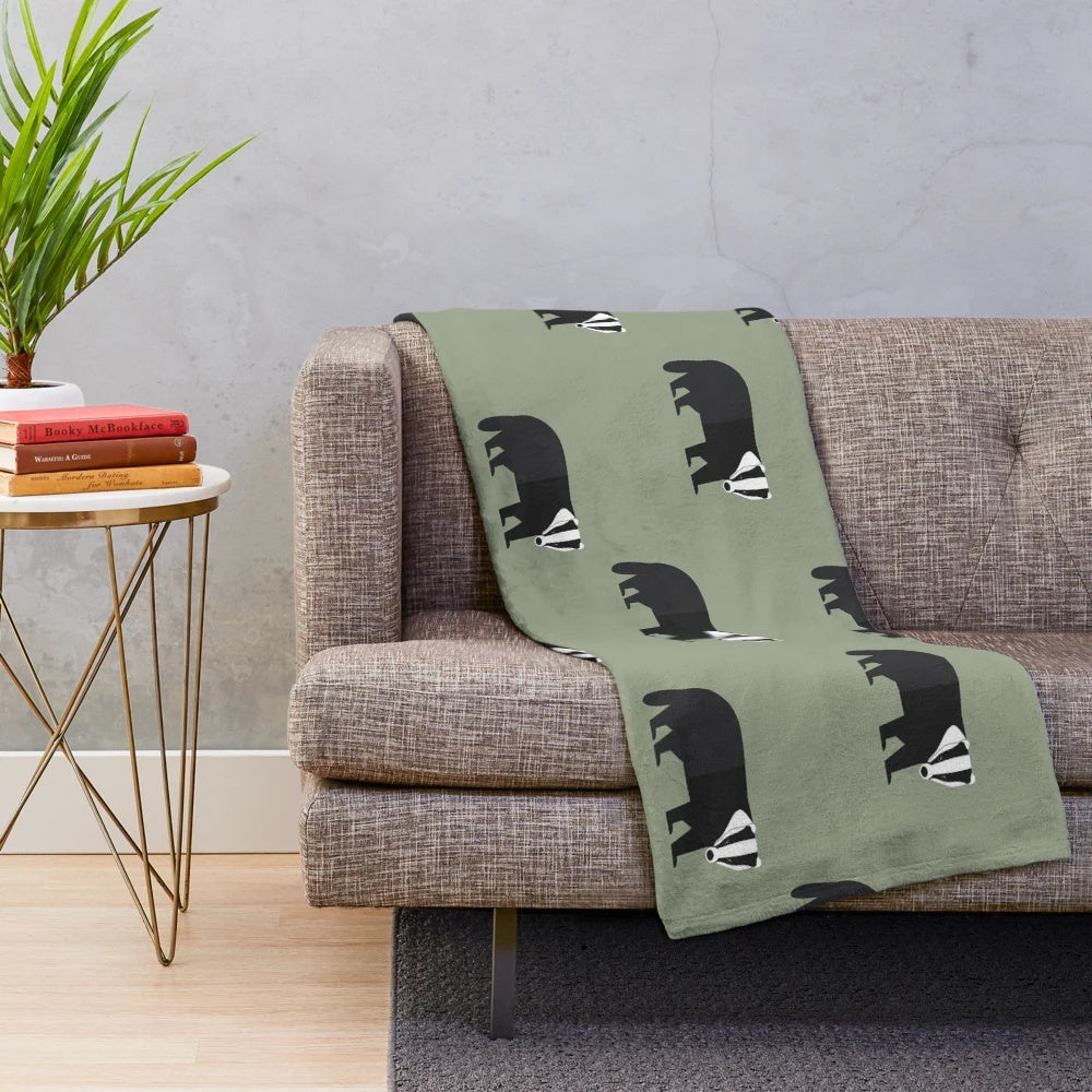 Plush blanket with a badger pattern in a forest-inspired design