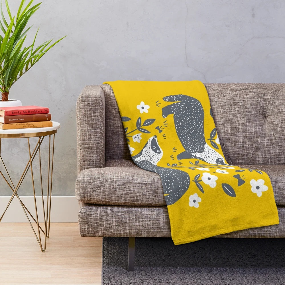 Soft and plush badgers blanket in yellow and gray colors