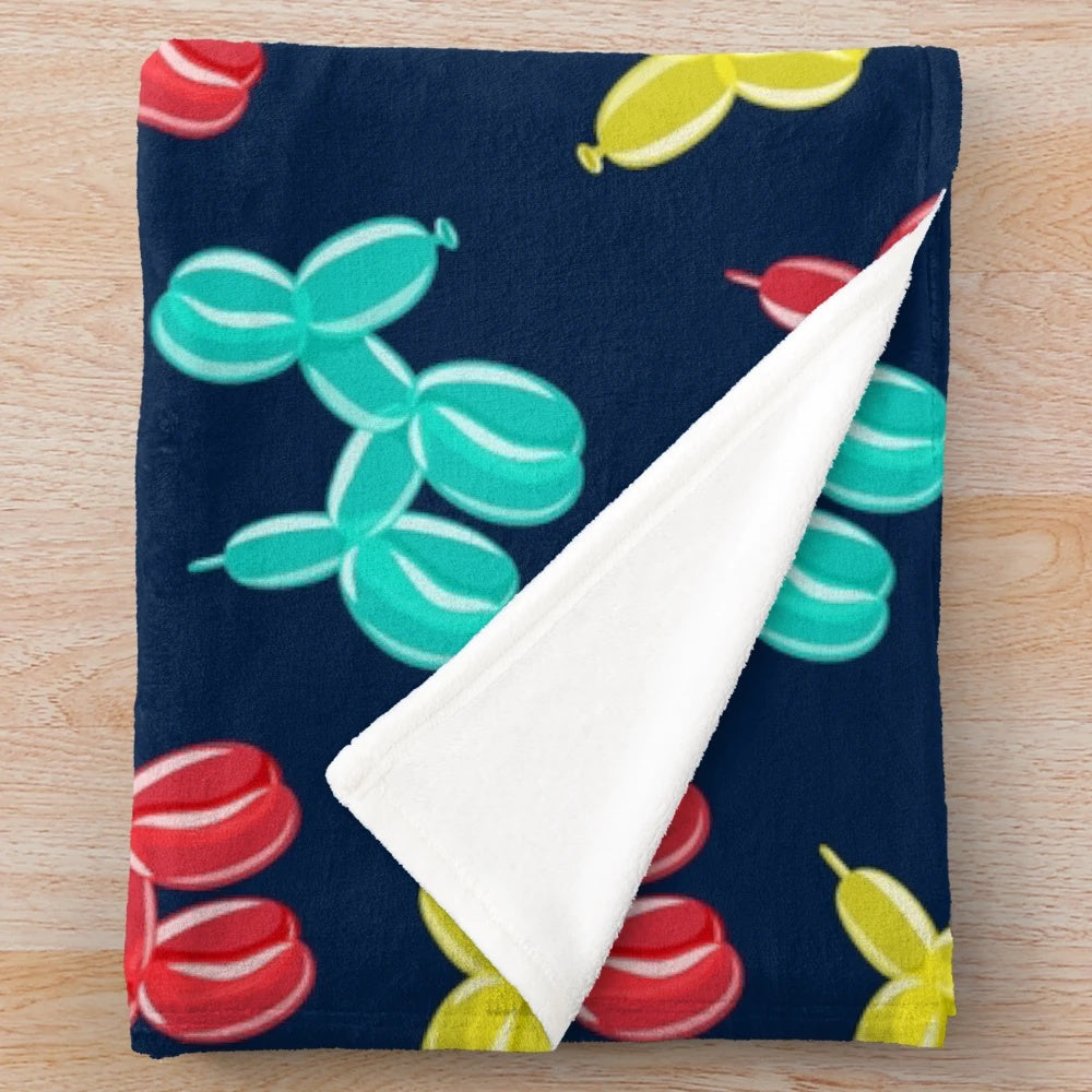 Soft and cuddly plush blanket with balloon dog design