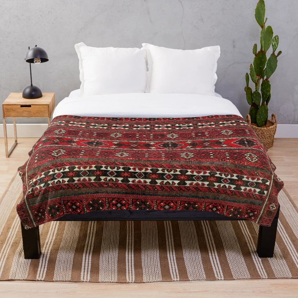 Antique-inspired plush blanket with Baluch flatweave rug design
