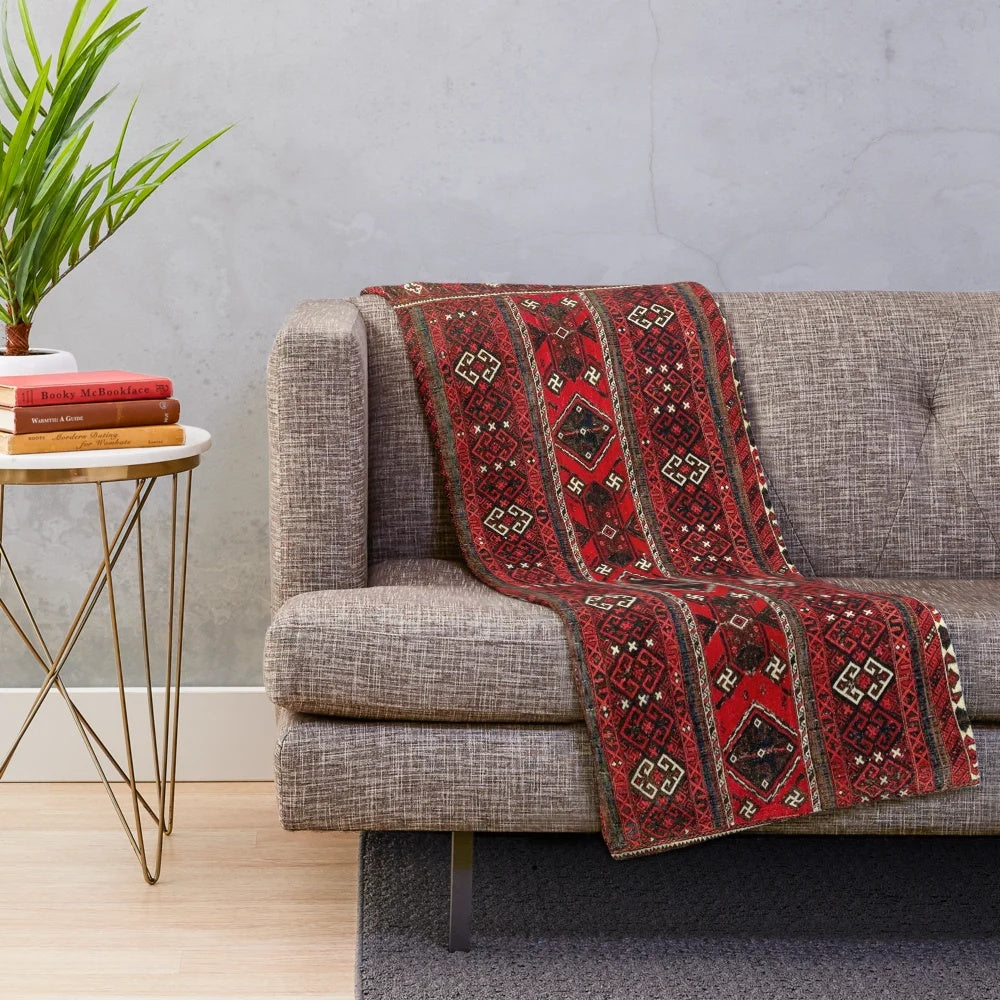 Antique-inspired plush blanket with Baluch flatweave rug design