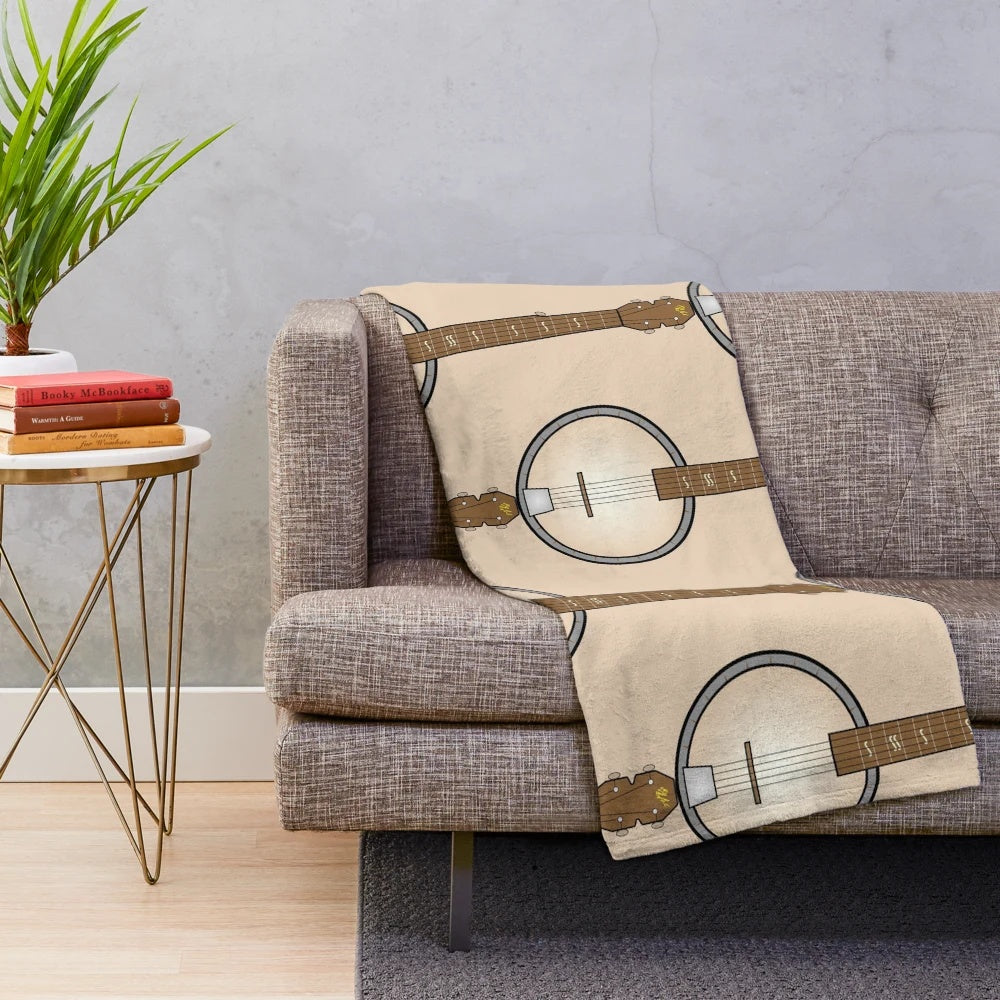 Banjo plush blanket featuring a musical instrument design