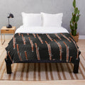 Cozy plush blanket with a bassoon design in black and gray