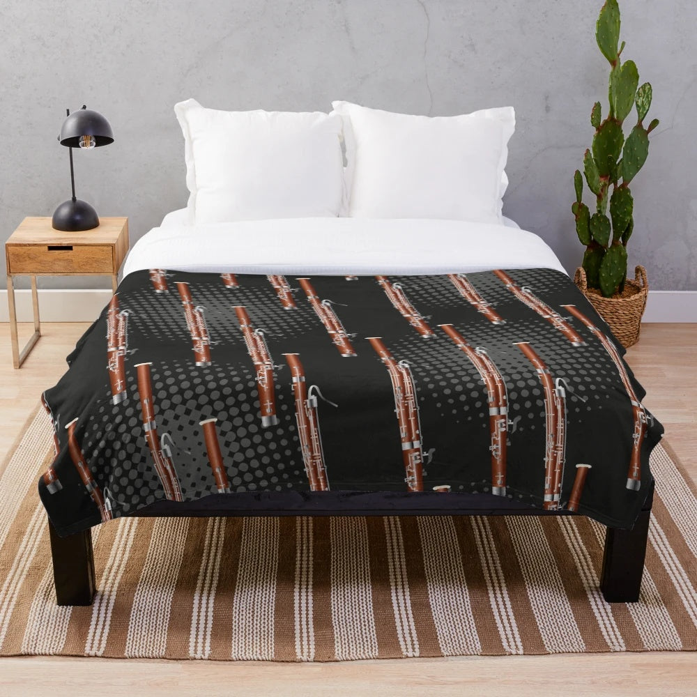 Cozy plush blanket with a bassoon design in black and gray