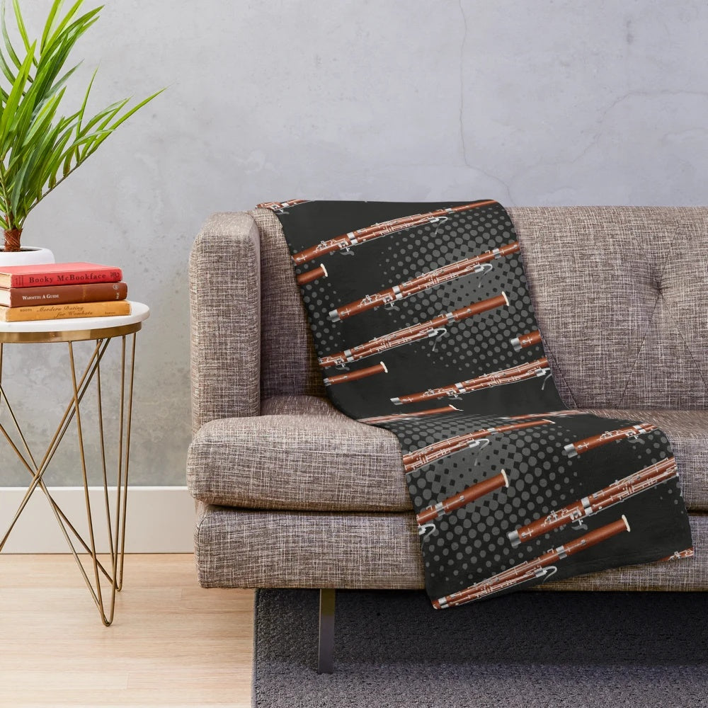 Cozy plush blanket with a bassoon design in black and gray