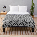 Plush grey blanket featuring a spooky bats design, perfect for Halloween and fall