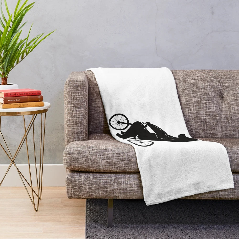 Plush blanket featuring a cute bear riding a bicycle