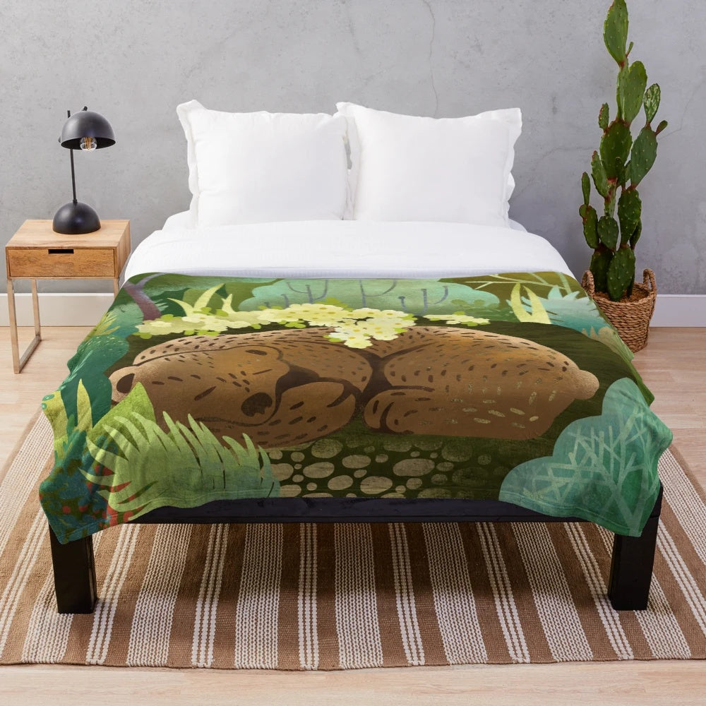 Soft and cuddly bear-themed plush blanket perfect for relaxing in nature