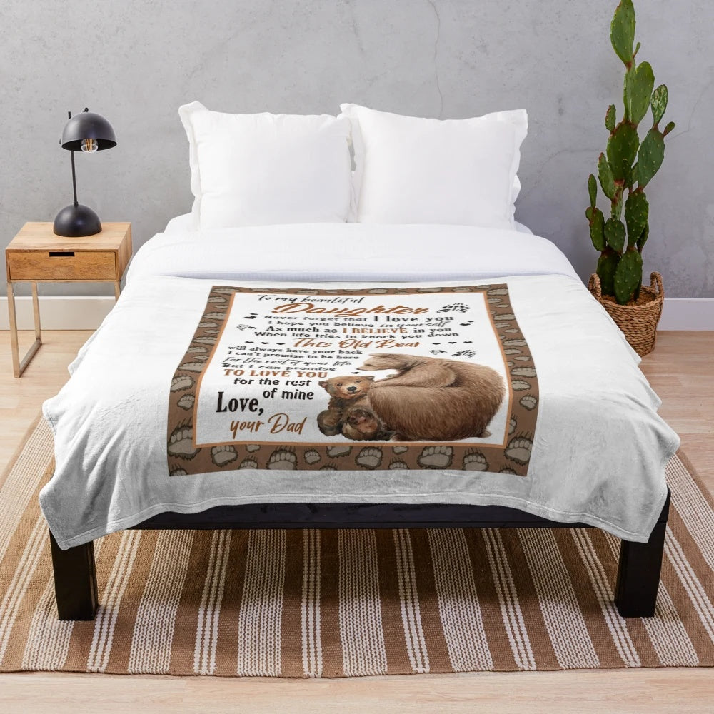 Plush blanket with a bear design representing the bond between a father and daughter