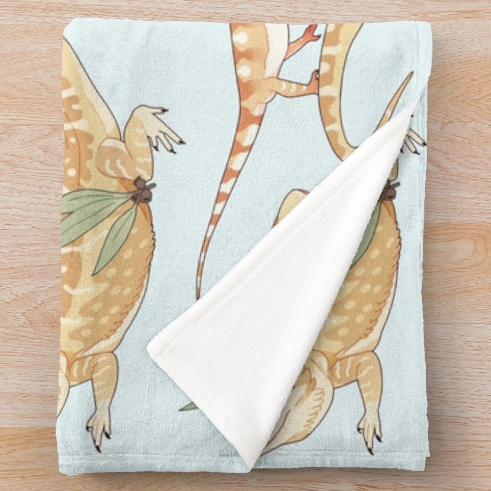 Plush bearded dragon-inspired blanket with a whimsical lizard and dragon pattern