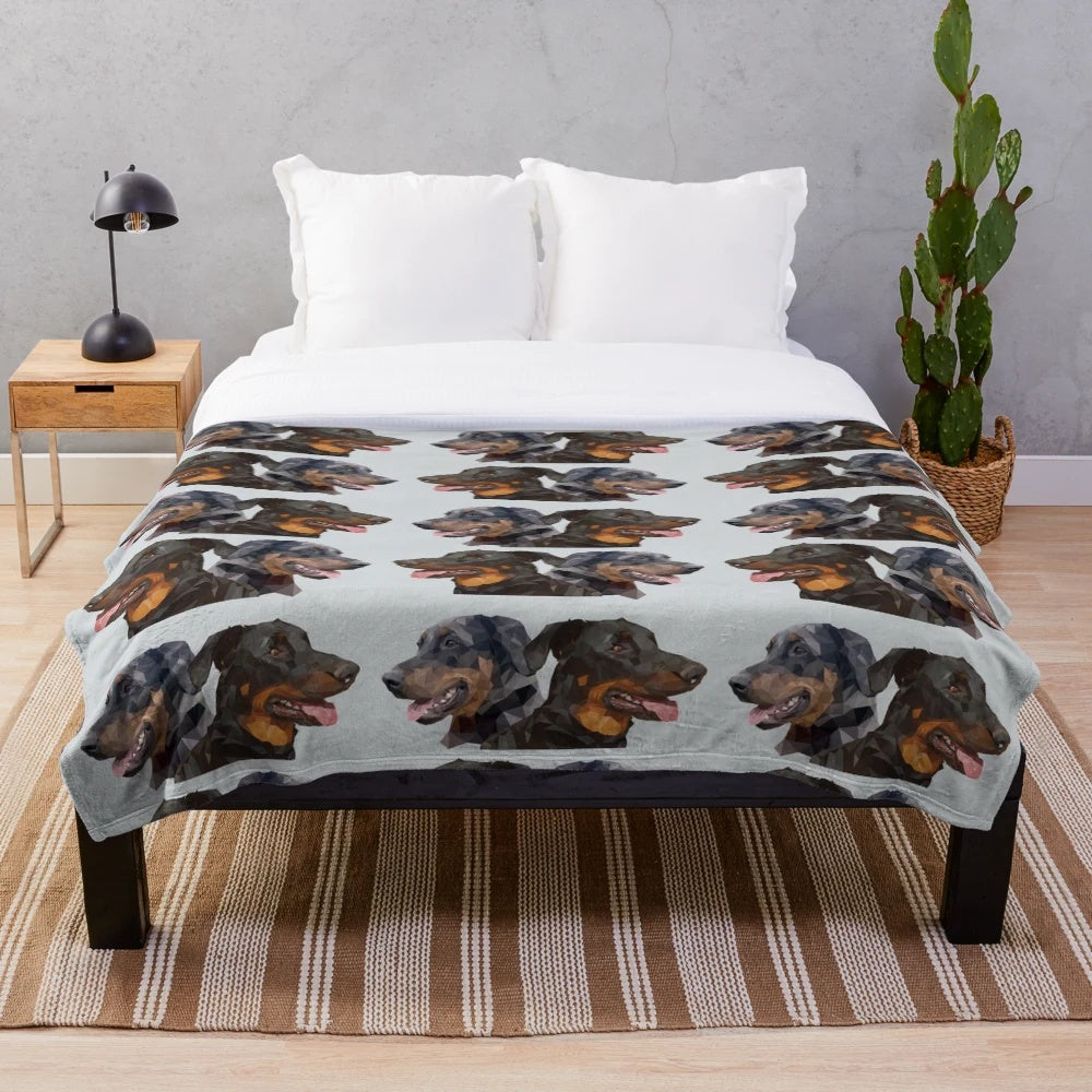 A soft, plush blanket featuring the beautiful Beauceron dog breed