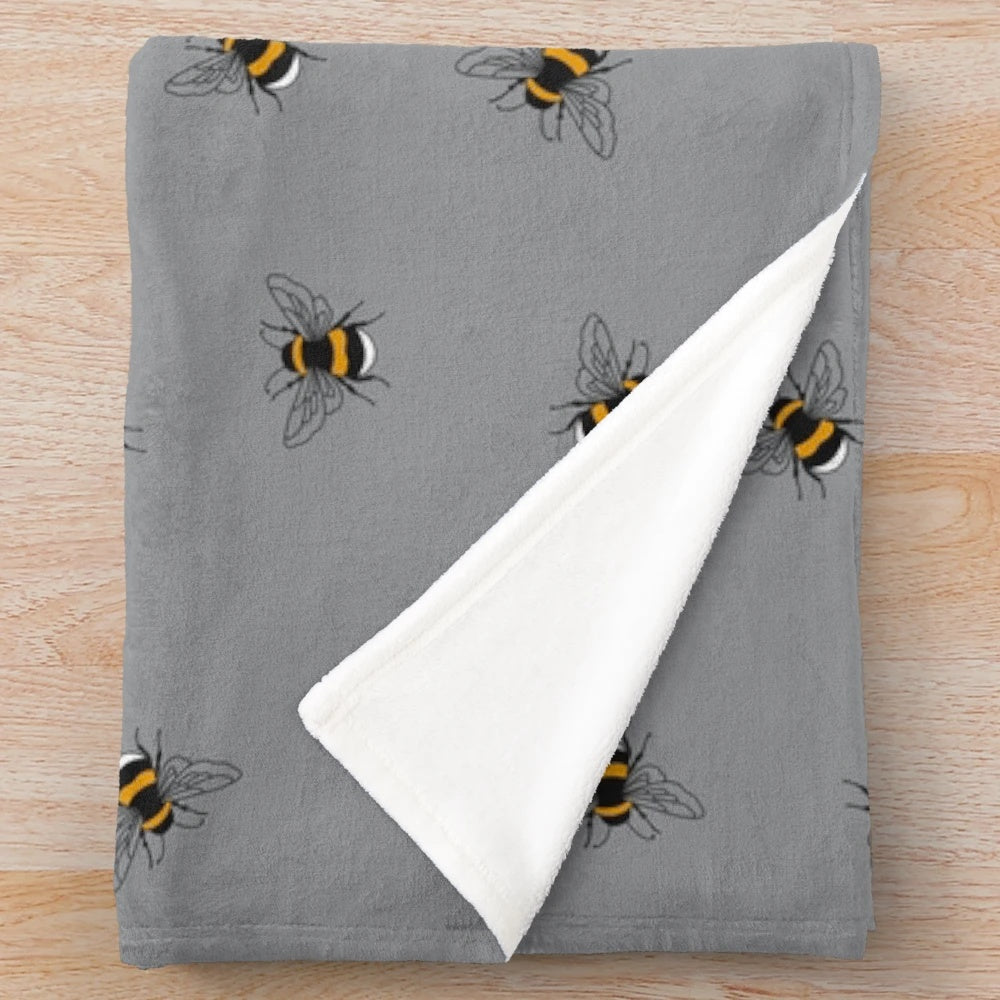 Plush bee-themed blanket with a cozy and nature-inspired design