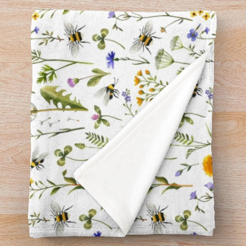 Bees and wildflowers plush blanket with a soft, white design