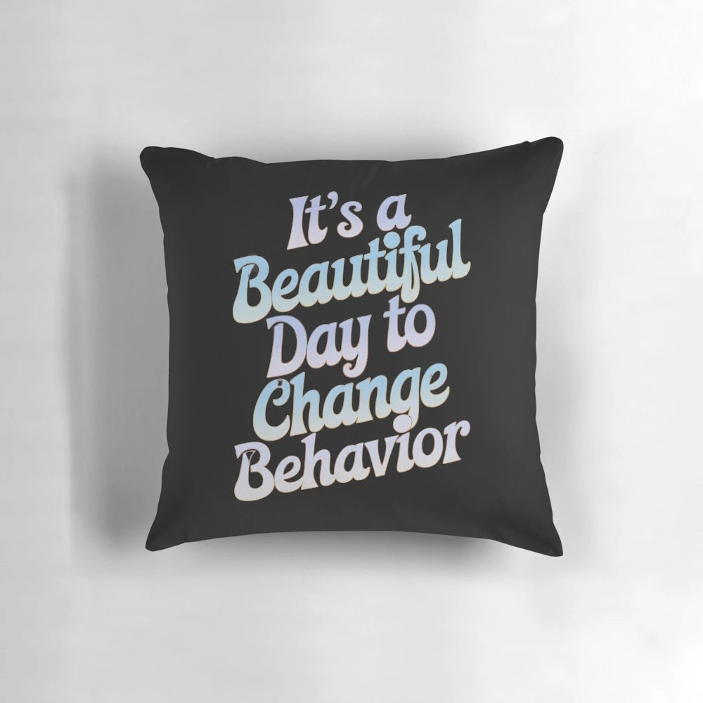 Colorful pillow with the text "It's a Beautiful Day to Change Behavior" for teachers and behavior analysts