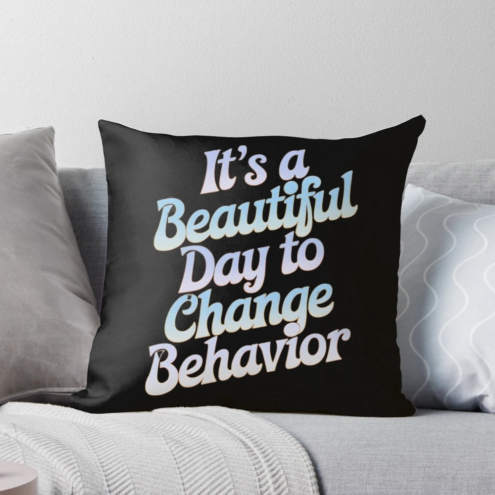 Colorful pillow with the text "It's a Beautiful Day to Change Behavior" for teachers and behavior analysts