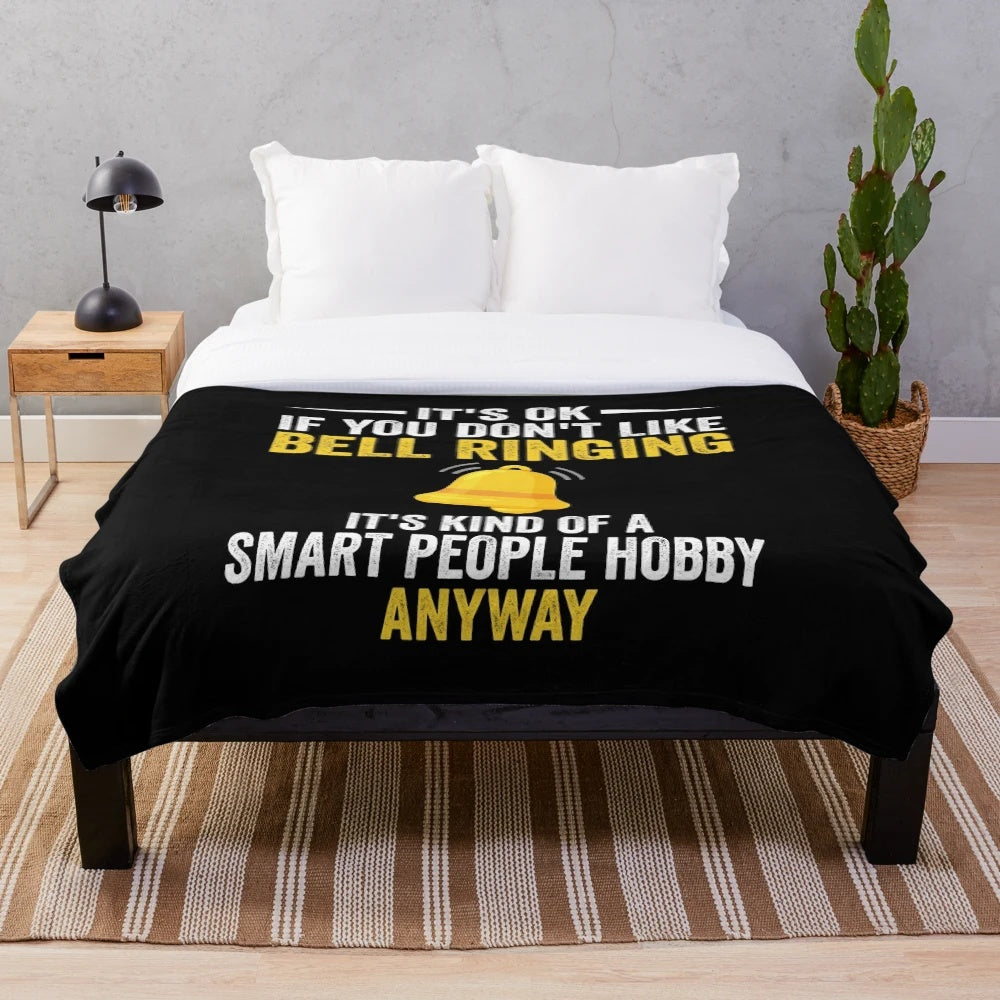 Bell ringing plush blanket with a humorous design for bell ringer hobbyists