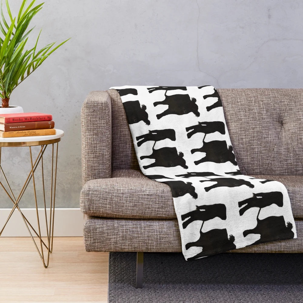 Belted Galloway cow plush blanket with soft, cozy texture