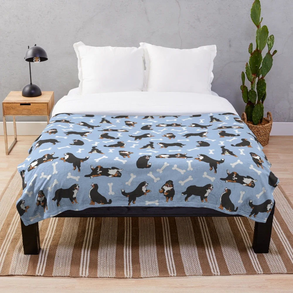 Soft and cuddly plush blanket featuring a cute cartoon Bernese Mountain Dog on a blue background