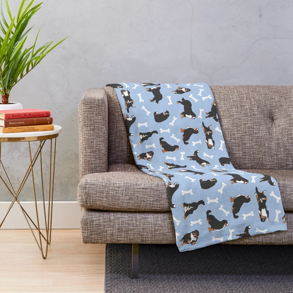 Soft and cuddly plush blanket featuring a cute cartoon Bernese Mountain Dog on a blue background