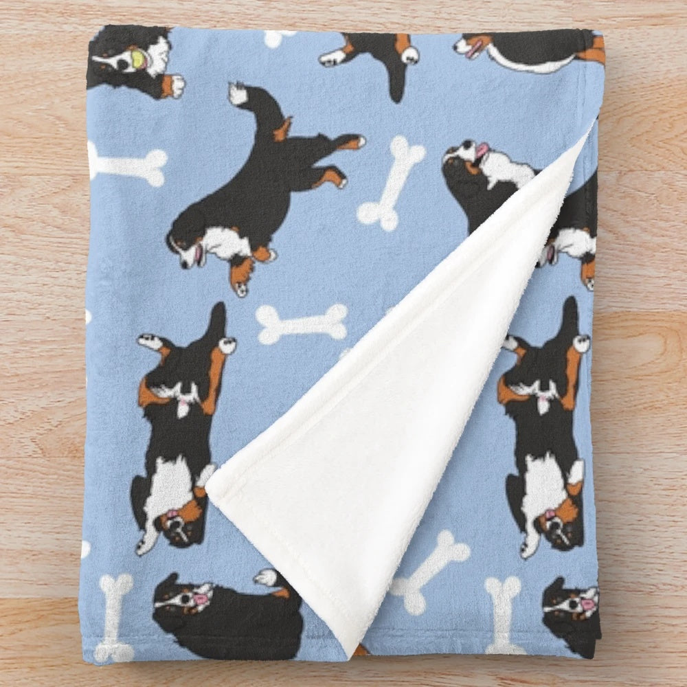 Soft and cuddly plush blanket featuring a cute cartoon Bernese Mountain Dog on a blue background