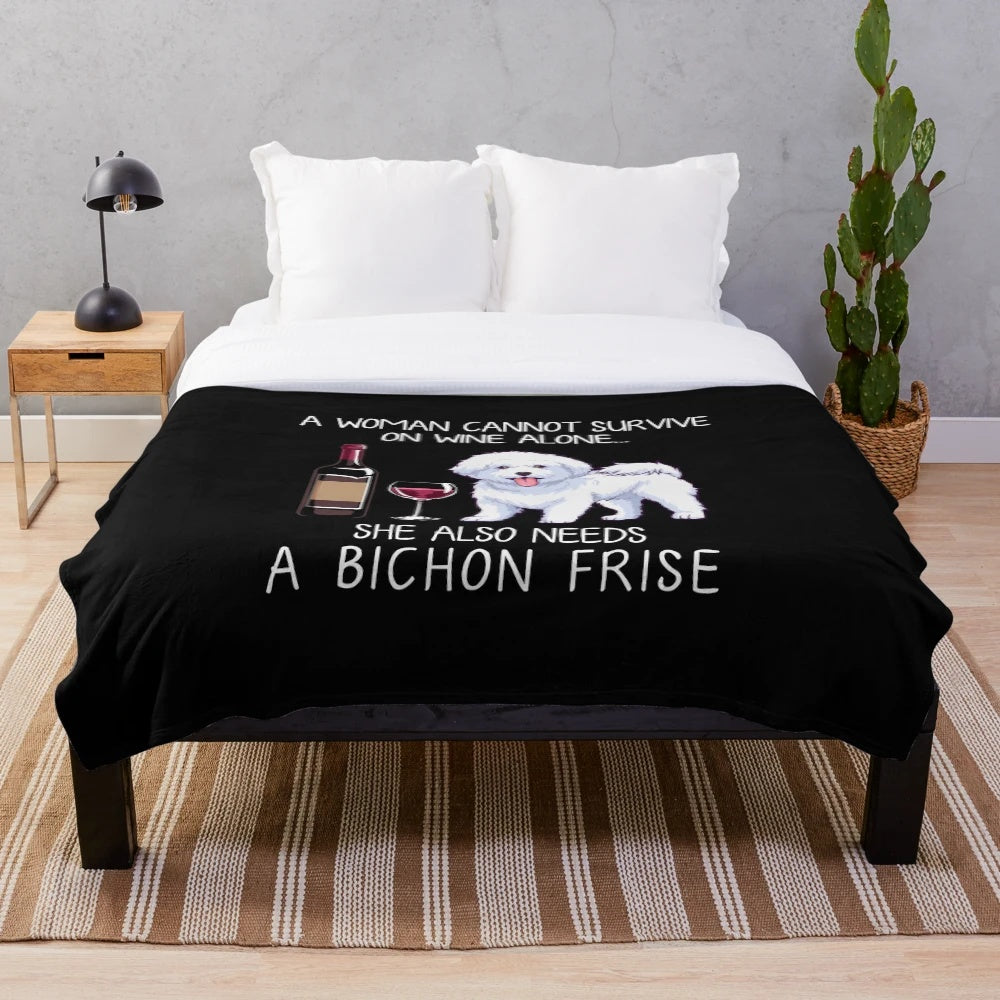 Bichon Frise dog on a plush blanket with a wine glass design