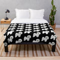 Bichon Frise dog on a plush white blanket