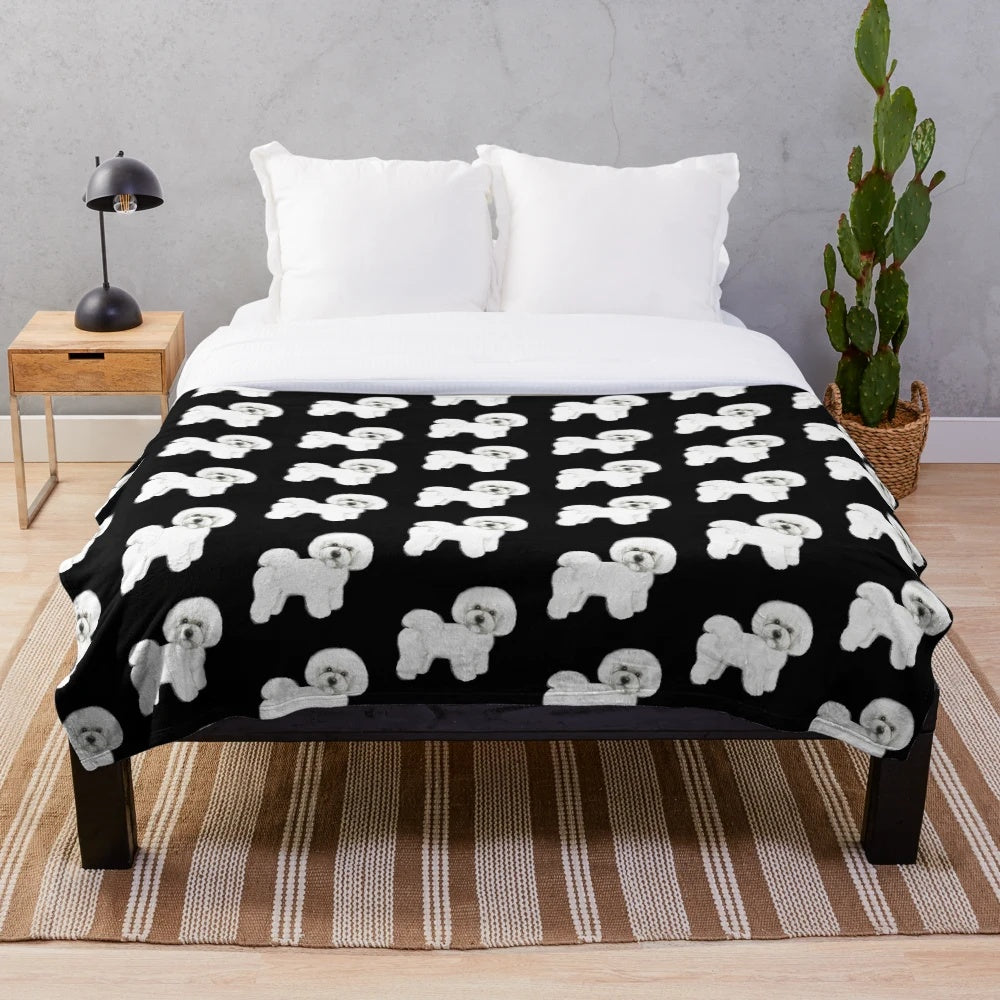 Bichon Frise dog on a plush white blanket