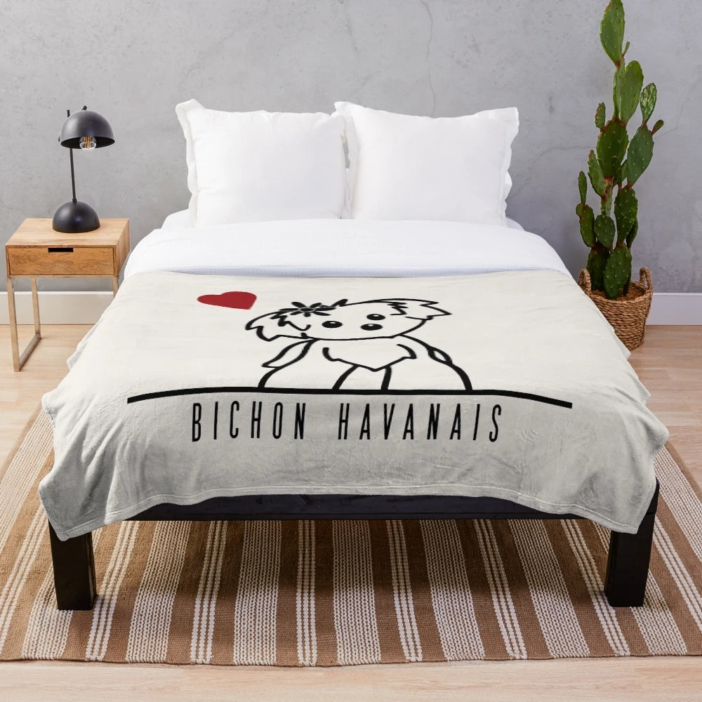 Bichon Havanais dog breed on a soft, plush blanket