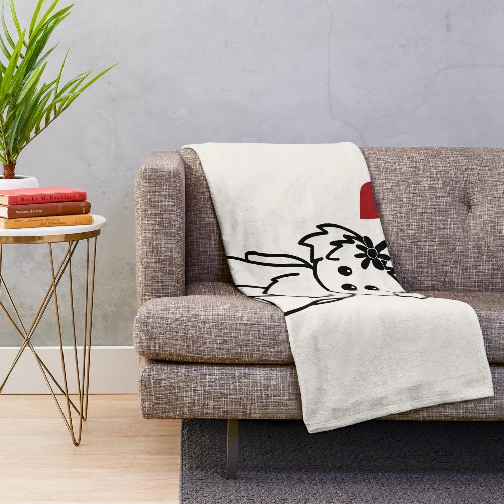 Bichon Havanais dog breed on a soft, plush blanket
