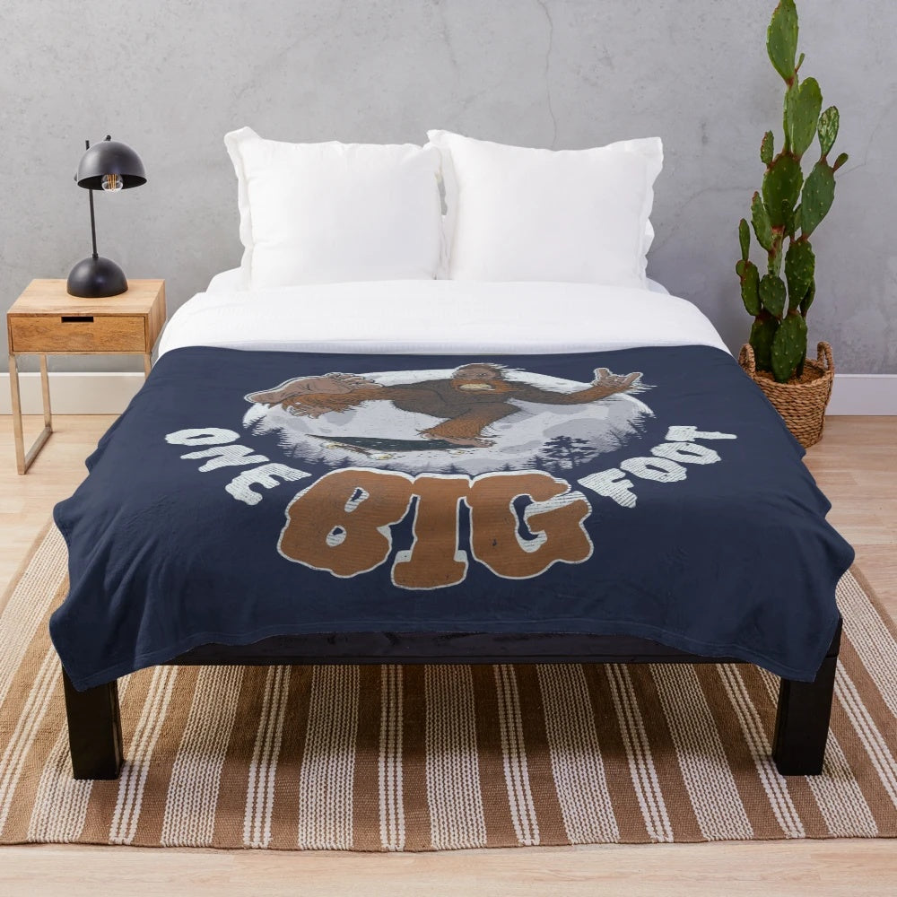 Cozy plush blanket featuring a bigfoot or sasquatch design