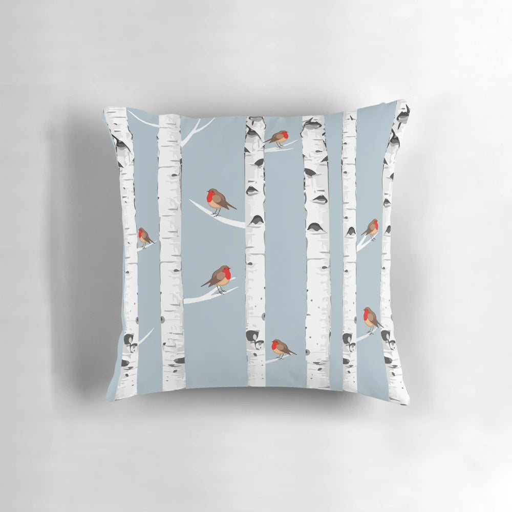A snowy forest scene featuring birch trees and a robin bird, perfect for nature lovers
