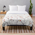 Birch tree and cardinal plush blanket with a nature-inspired design