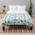 Soft and cozy plush blanket featuring a beautiful bird design