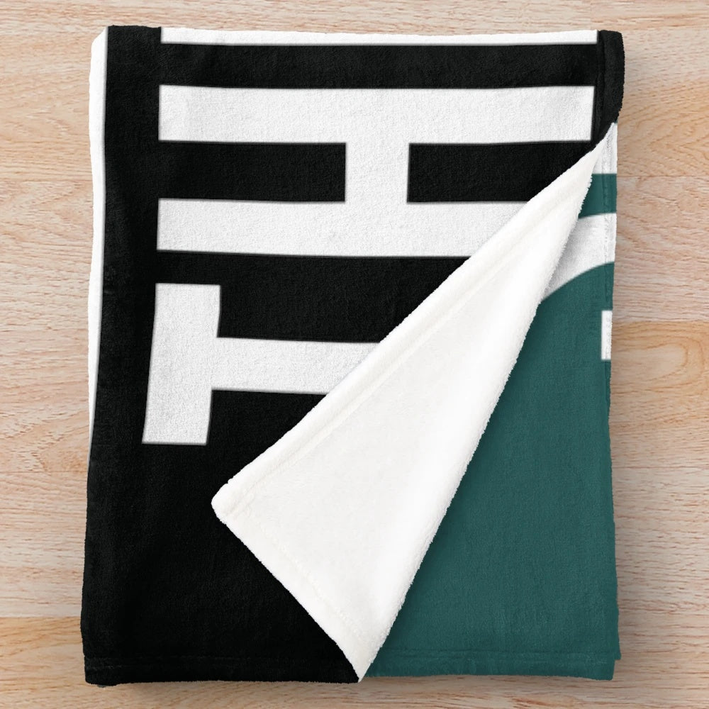 Plush blanket featuring birds and football imagery