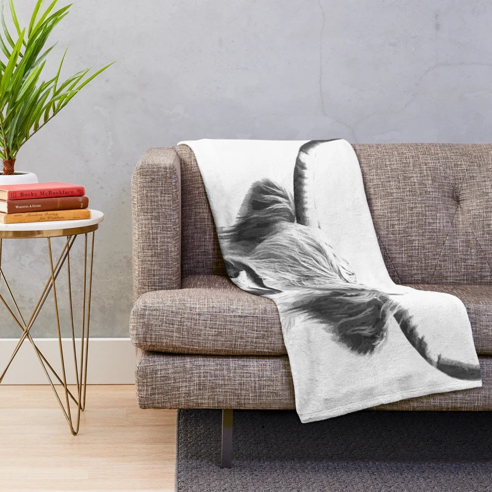 Soft and cuddly black and white highland cow plush blanket