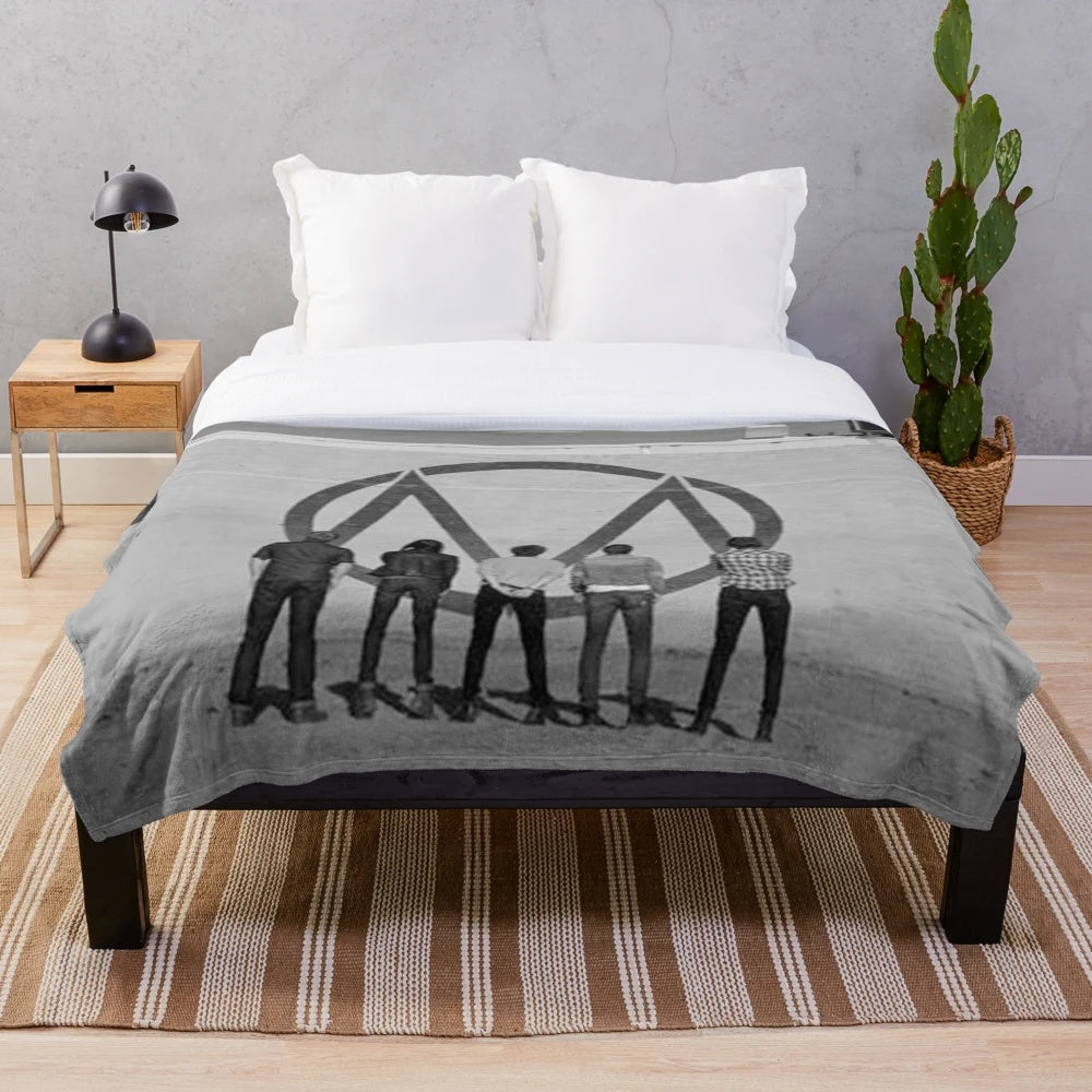 Black and white plush blanket with The Maine "Looking Up" design