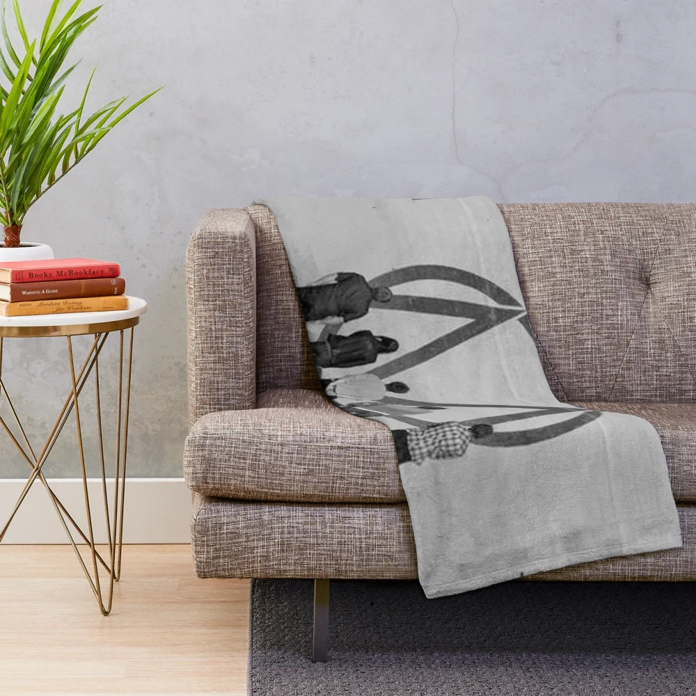 Black and white plush blanket with The Maine "Looking Up" design