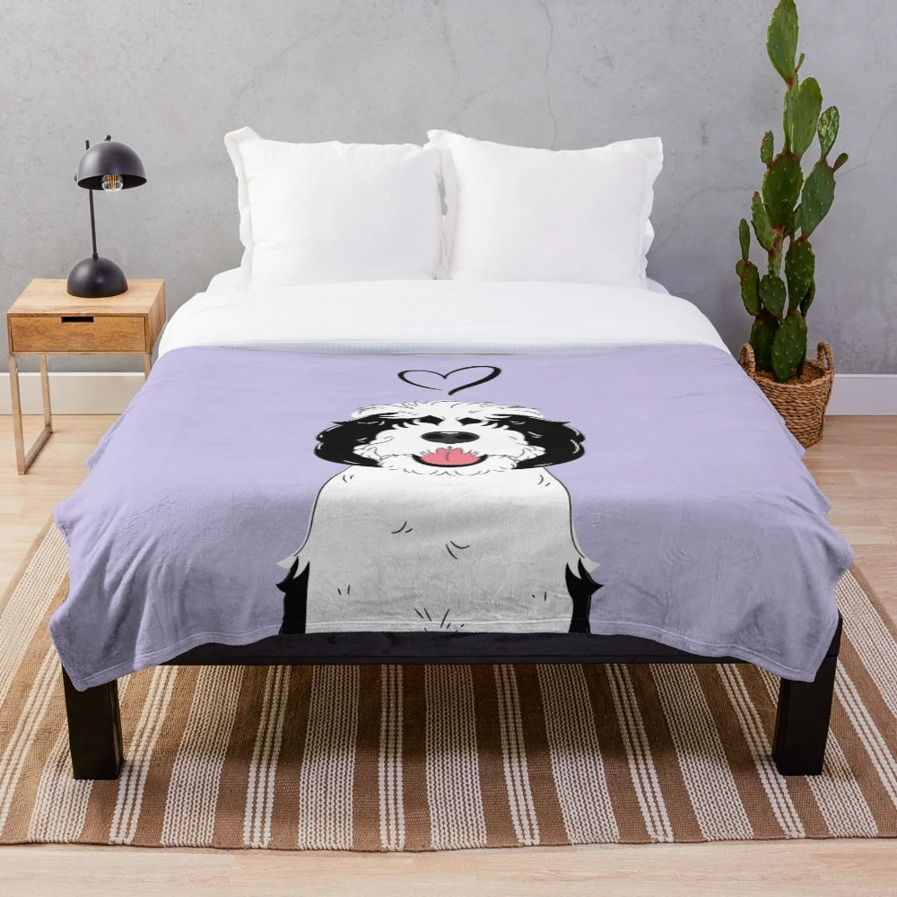 Black and white sheepadoodle dog printed on a soft lilac plush blanket