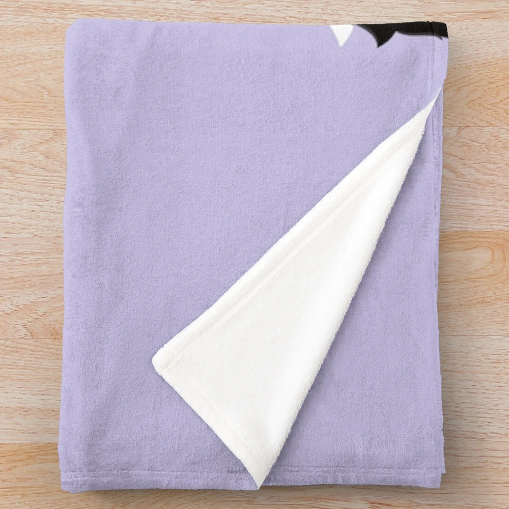 Black and white sheepadoodle dog printed on a soft lilac plush blanket