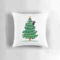 Soft, fluffy black cat nestled in a Christmas tree on a decorative pillow