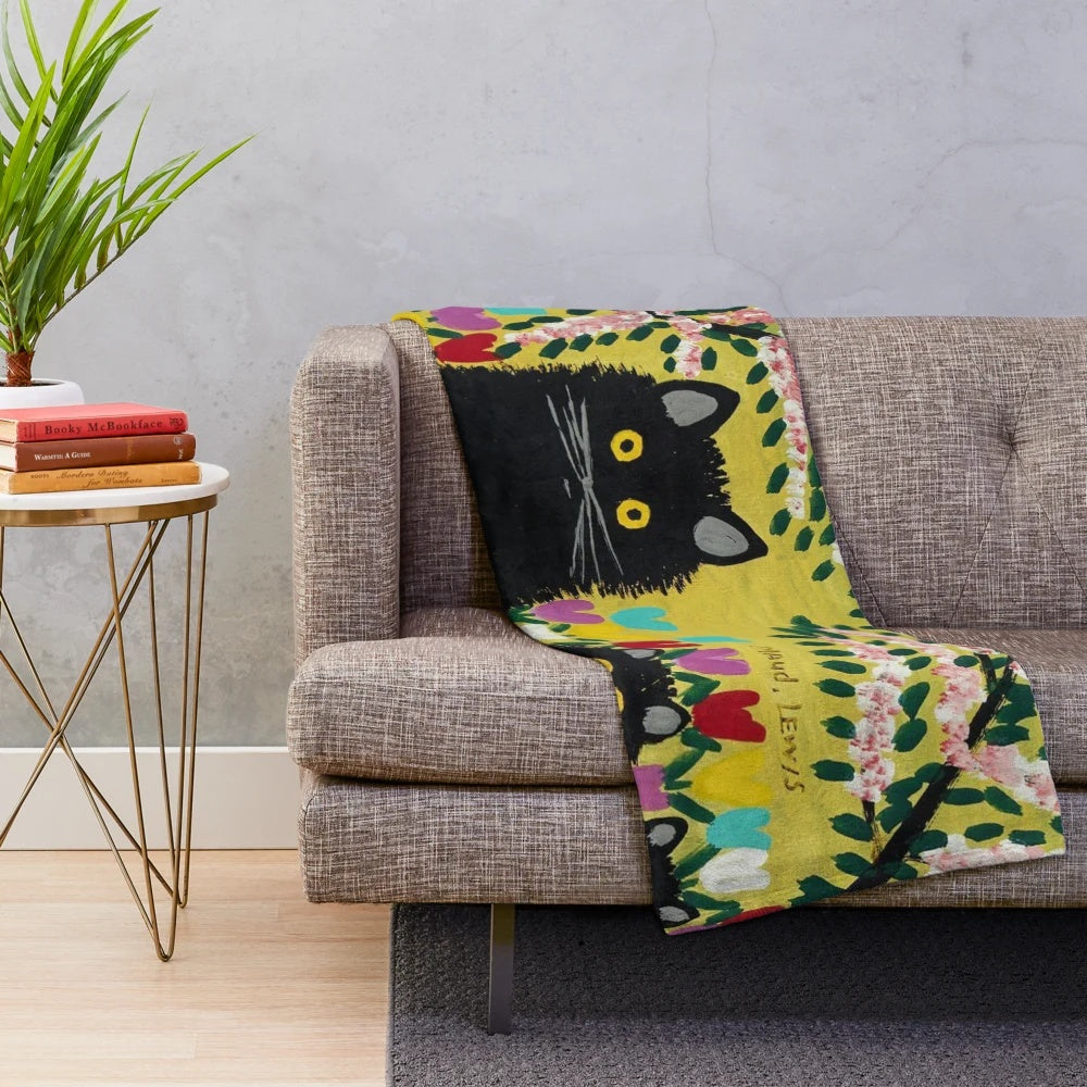 Plush black cat throw blanket featuring Maud Lewis inspired cat artwork