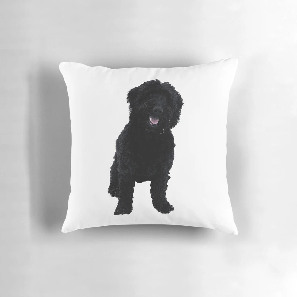 A soft, plush pillow featuring a black goldendoodle dog
