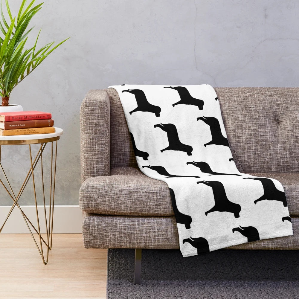 A black labrador inspired plush blanket with a silhouette design